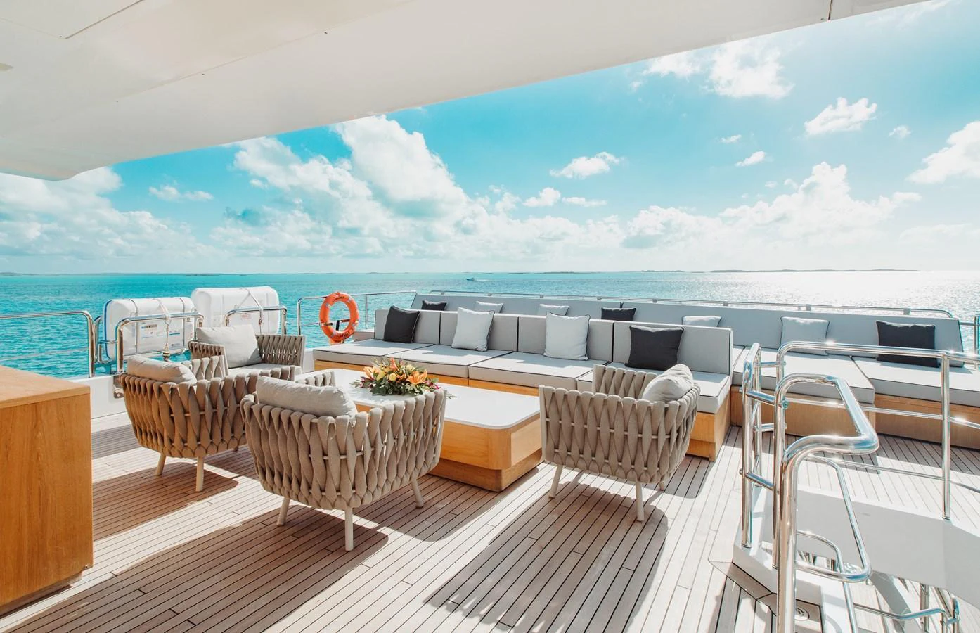 The aft deck offers a luxurious outdoor seating area with stunning ocean views. aboard EMINA Yacht for Sale
