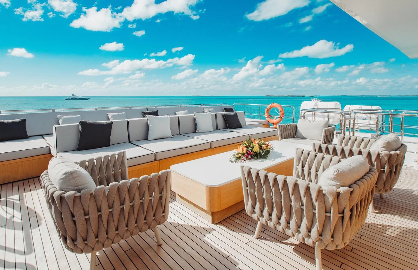 The aft deck offers a luxurious outdoor seating area with stunning ocean views. aboard EMINA Yacht for Sale