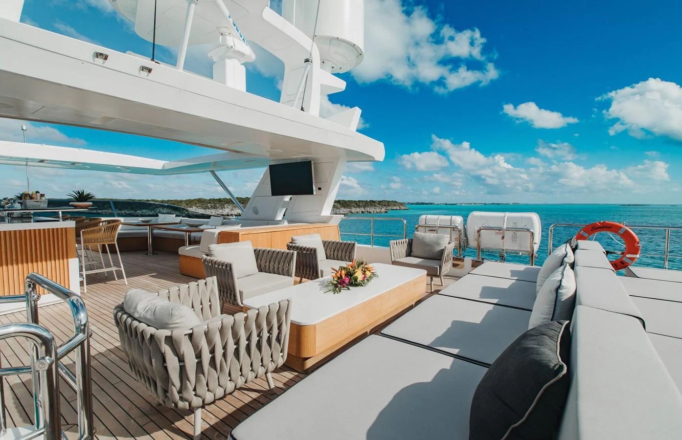 The sundeck offers luxurious lounging areas with stunning ocean views. aboard EMINA Yacht for Sale