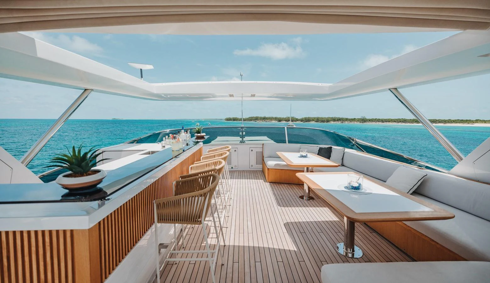 The flybridge offers a spacious and luxurious outdoor area with ample seating and a bar, perfect for relaxation and entertainment. aboard EMINA Yacht for Sale