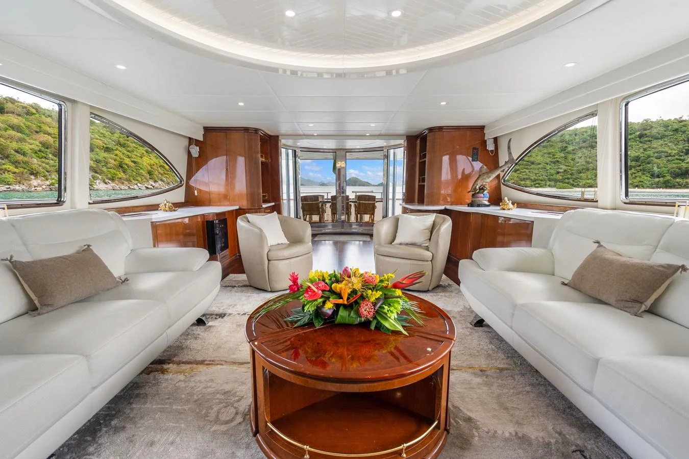 a living room with a table and chairs aboard CALAIS Yacht for Sale