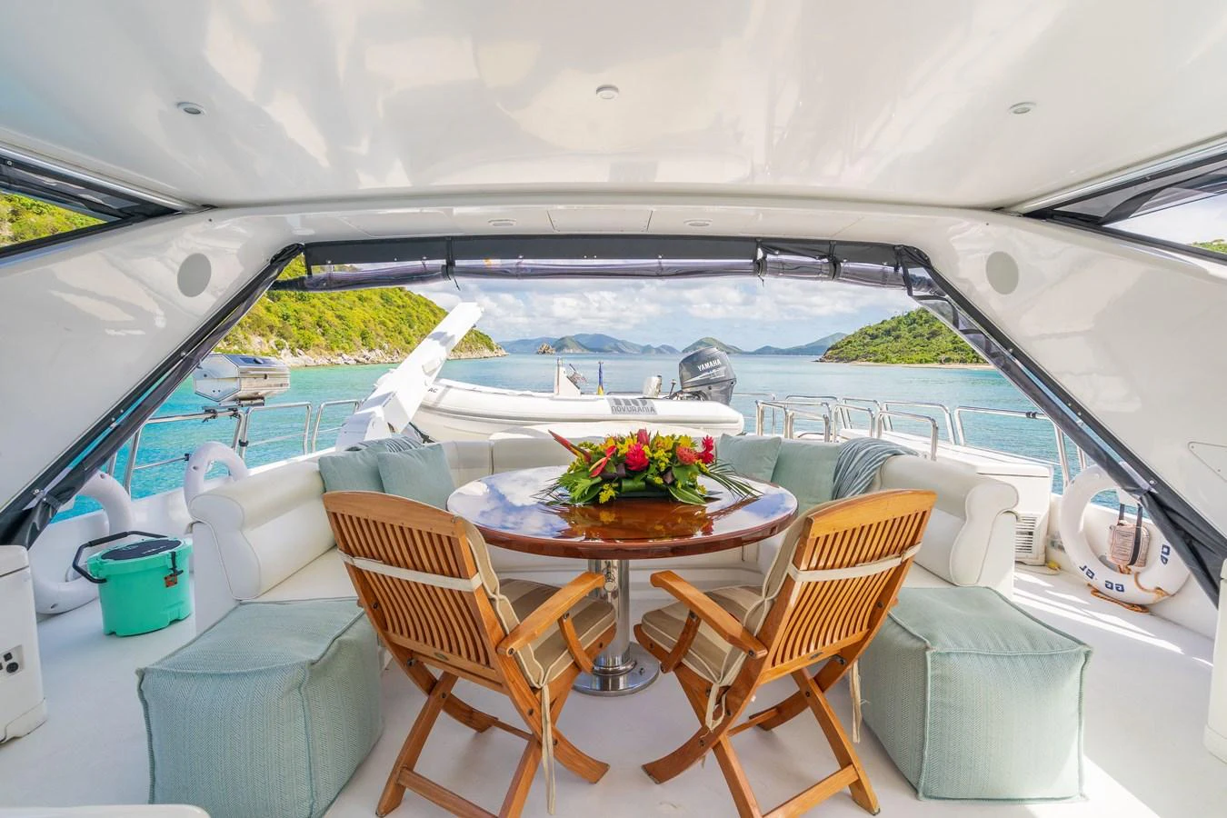 a table and chairs on a balcony aboard CALAIS Yacht for Sale