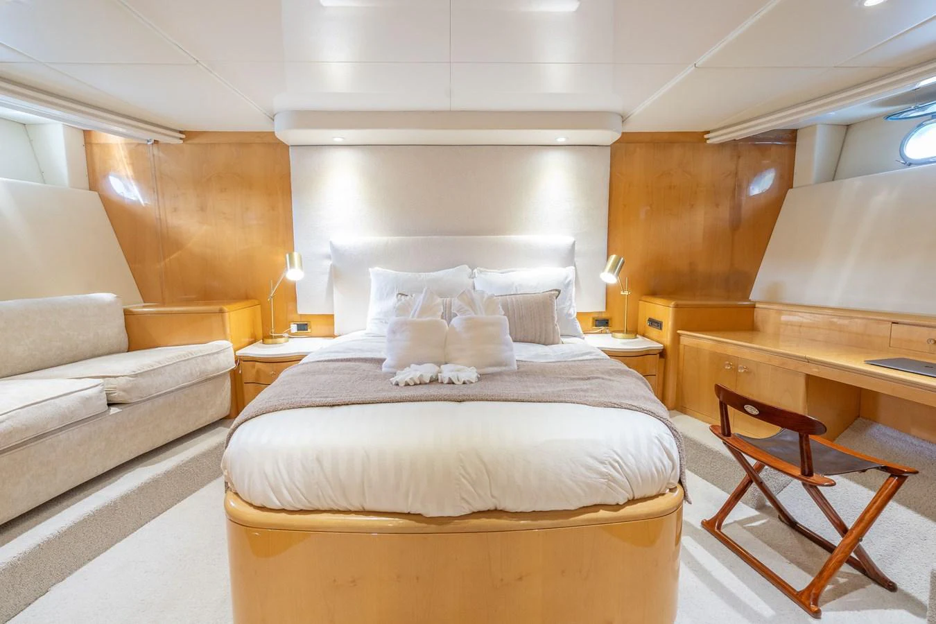 a room with a bed and a couch aboard CALAIS Yacht for Sale