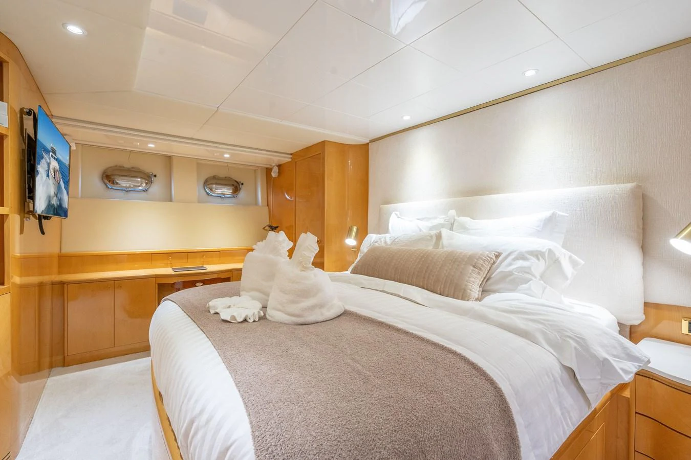 a room with a bed and a television aboard CALAIS Yacht for Sale