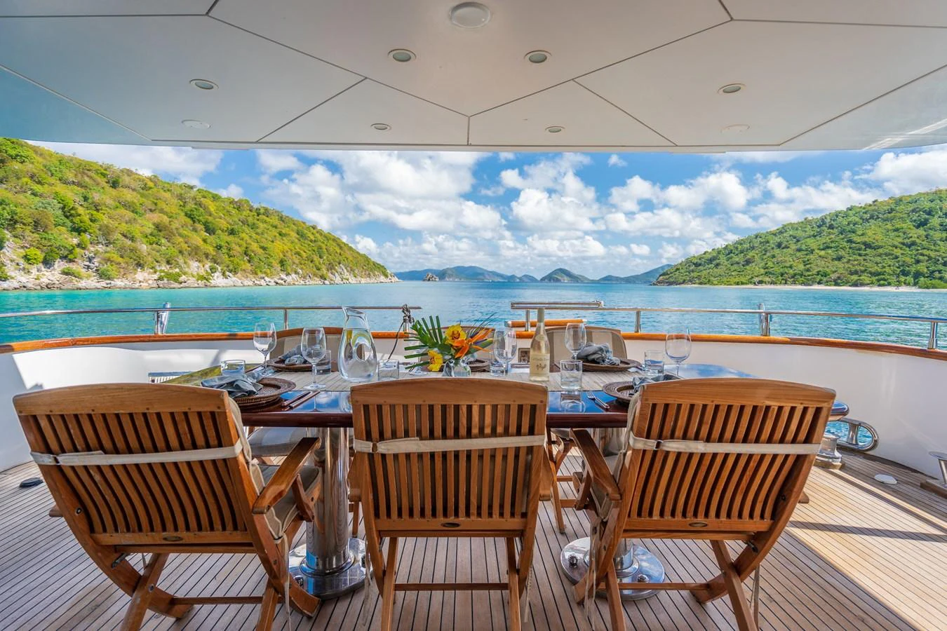 a table set for a meal on a boat aboard CALAIS Yacht for Sale
