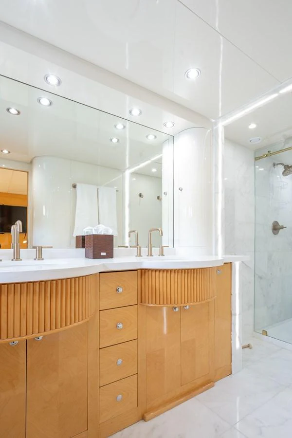 a bathroom with a large mirror aboard CALAIS Yacht for Sale
