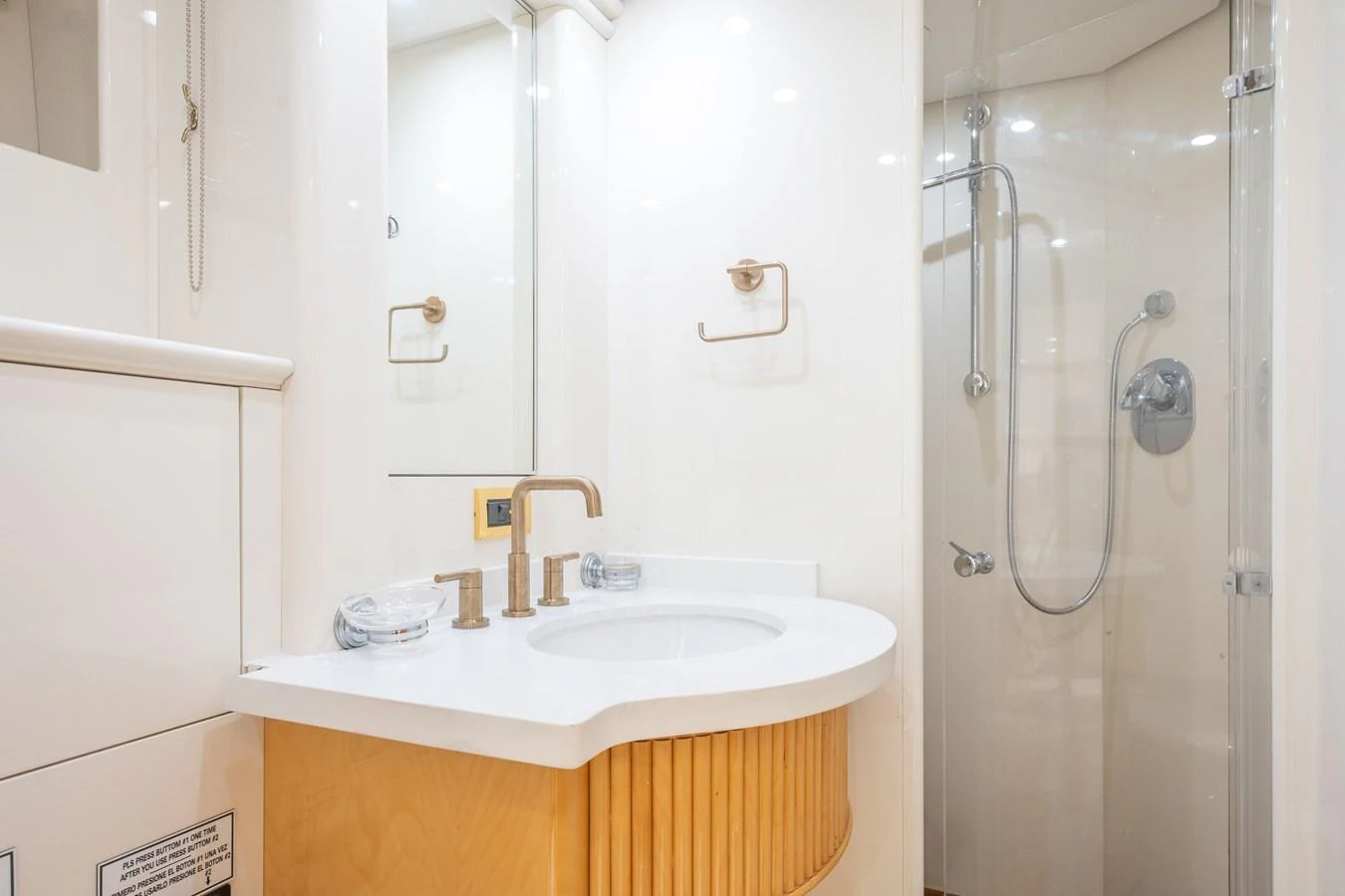 a bathroom with a shower and sink aboard CALAIS Yacht for Sale