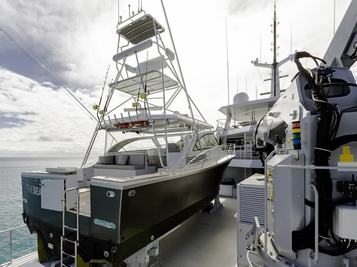 A sleek tender is securely positioned on the deck of a larger yacht, ready for deployment. aboard THE BEAST Yacht for Sale
