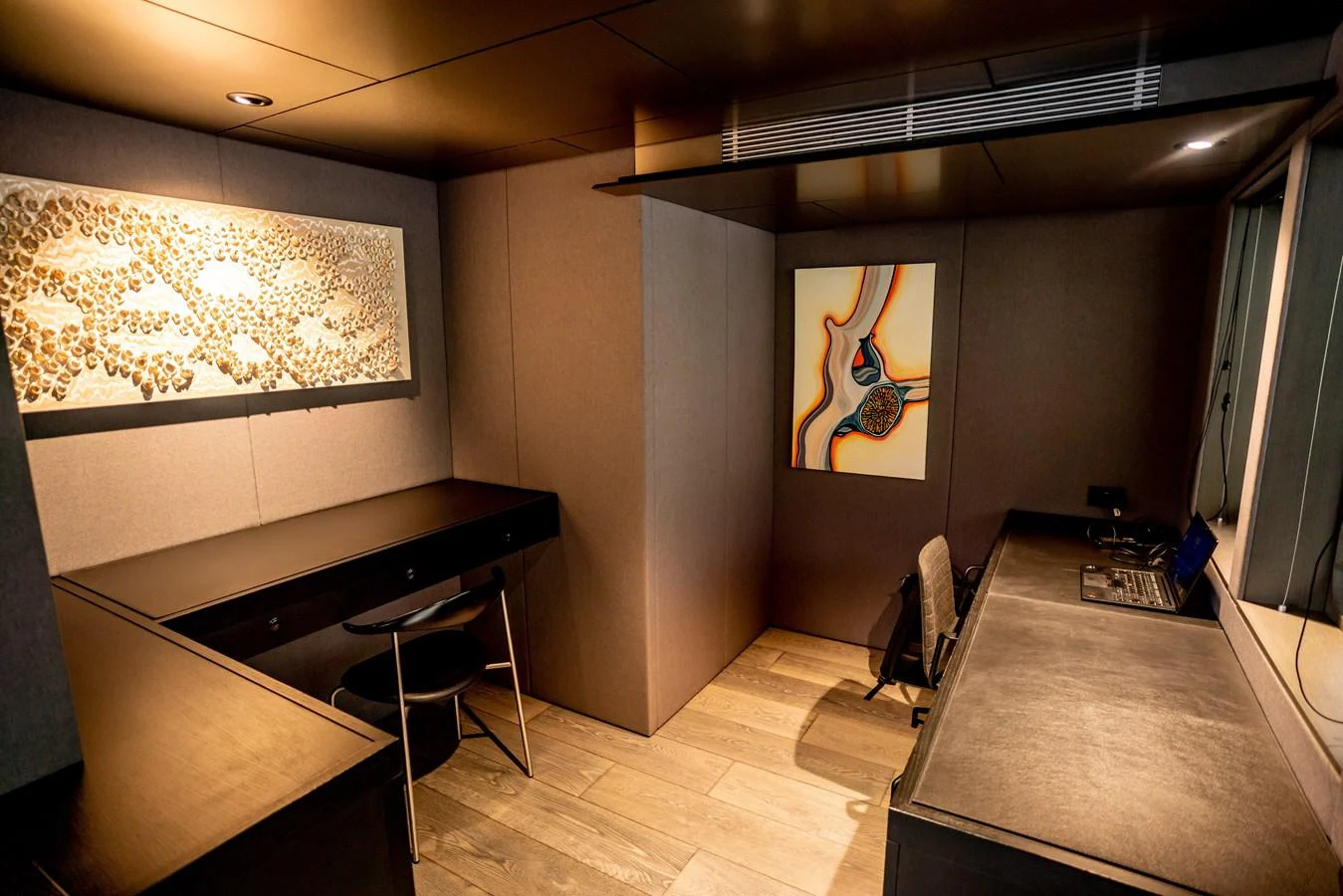 A sophisticated yacht office with modern furnishings and artistic decor. aboard THE BEAST Yacht for Sale