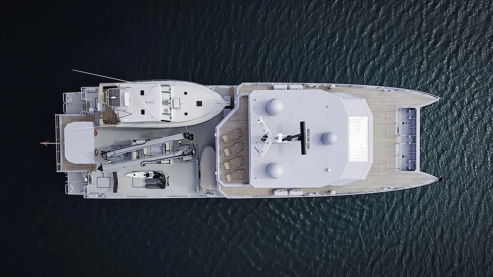 An aerial view of a luxurious yacht showcasing its expansive deck and amenities. aboard THE BEAST Yacht for Sale