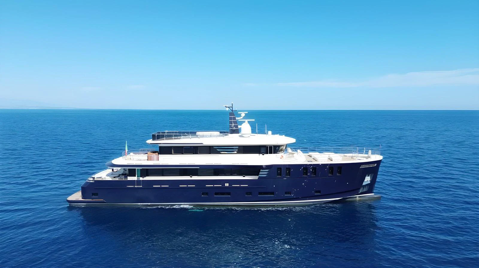 A sleek and modern yacht cruising on calm blue waters under a clear sky. aboard CLASSICA 40 Yacht for Sale