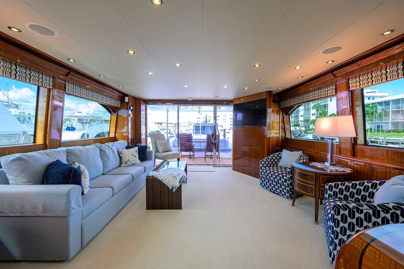 The salon offers a spacious and inviting area with comfortable seating and large windows for natural light. aboard SAPPHIRE Yacht for Sale