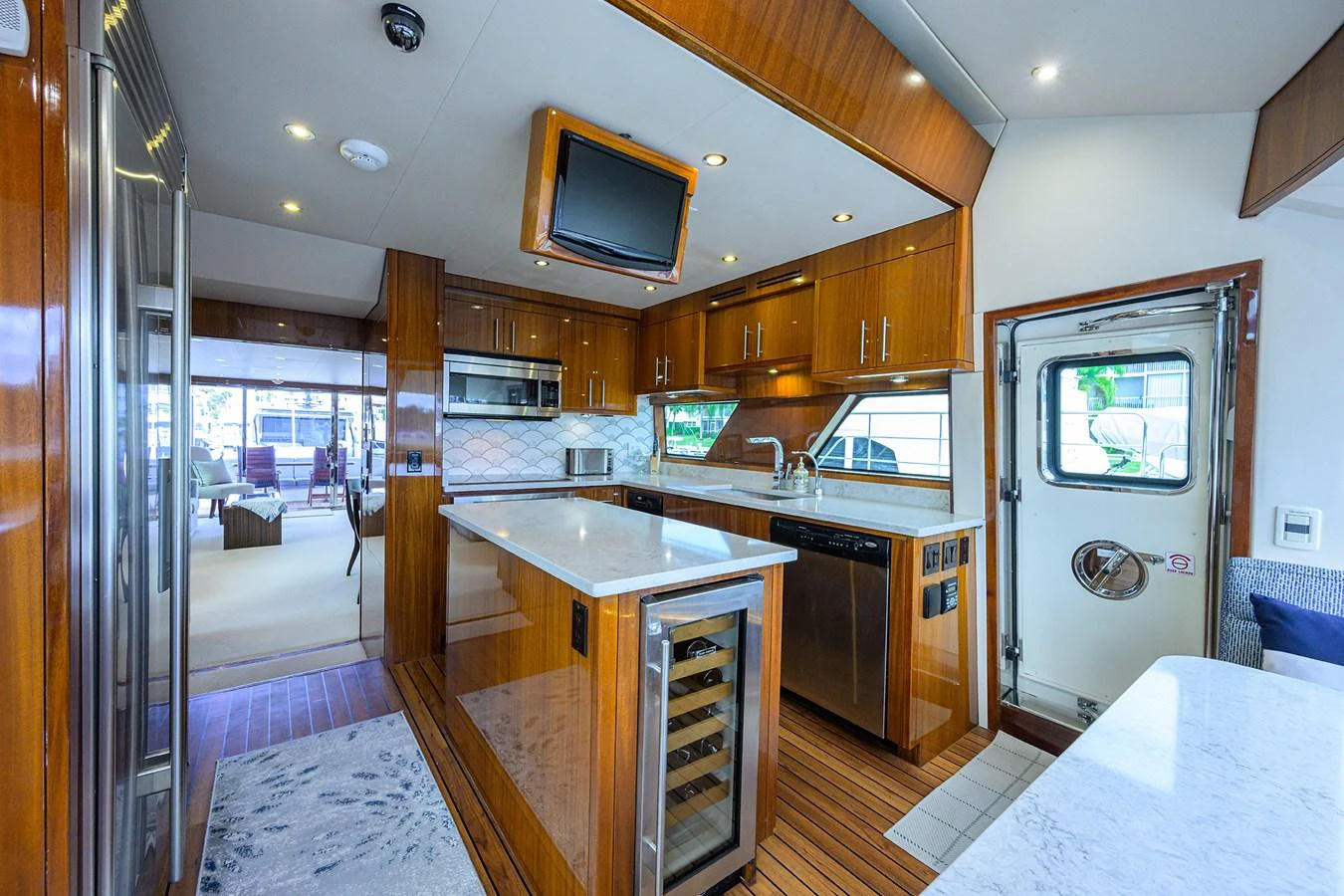The galley features modern appliances and elegant wood finishes, creating a warm and inviting space for culinary activities. aboard SAPPHIRE Yacht for Sale