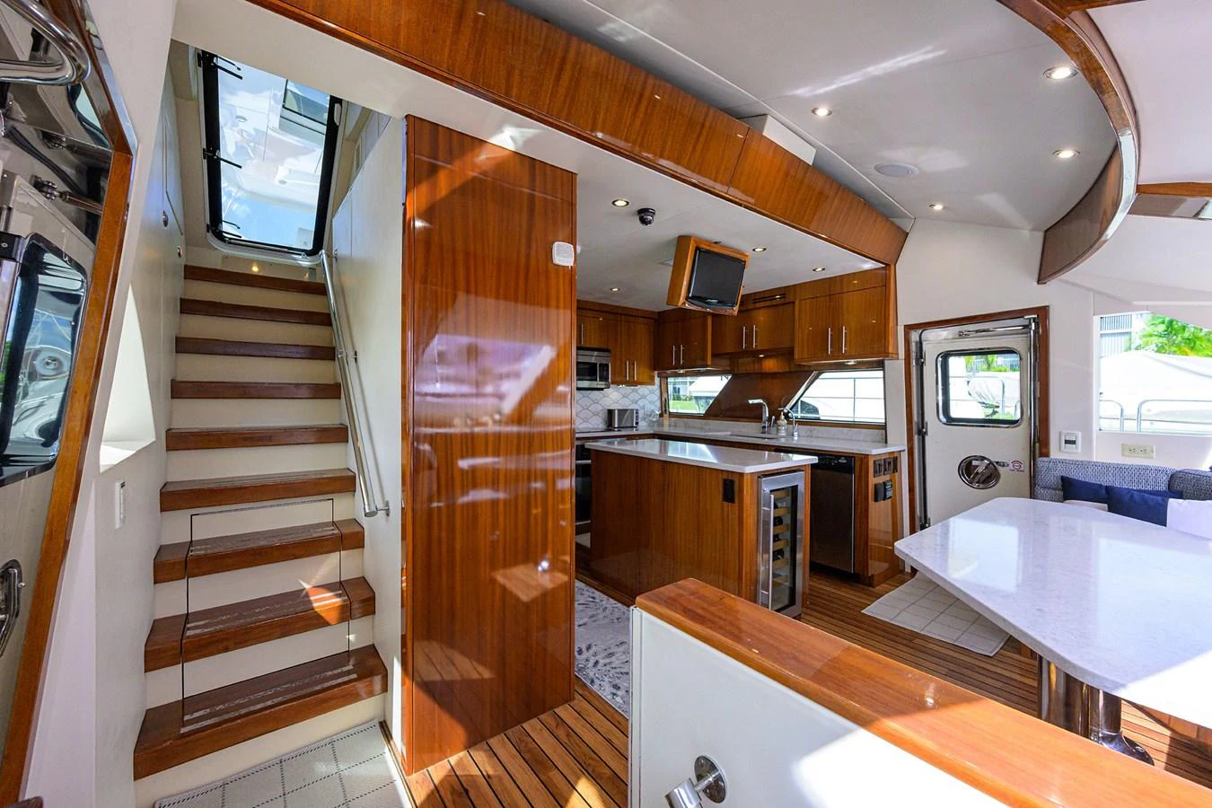 The yacht's galley features polished wood finishes, modern appliances, and ample natural light. aboard SAPPHIRE Yacht for Sale