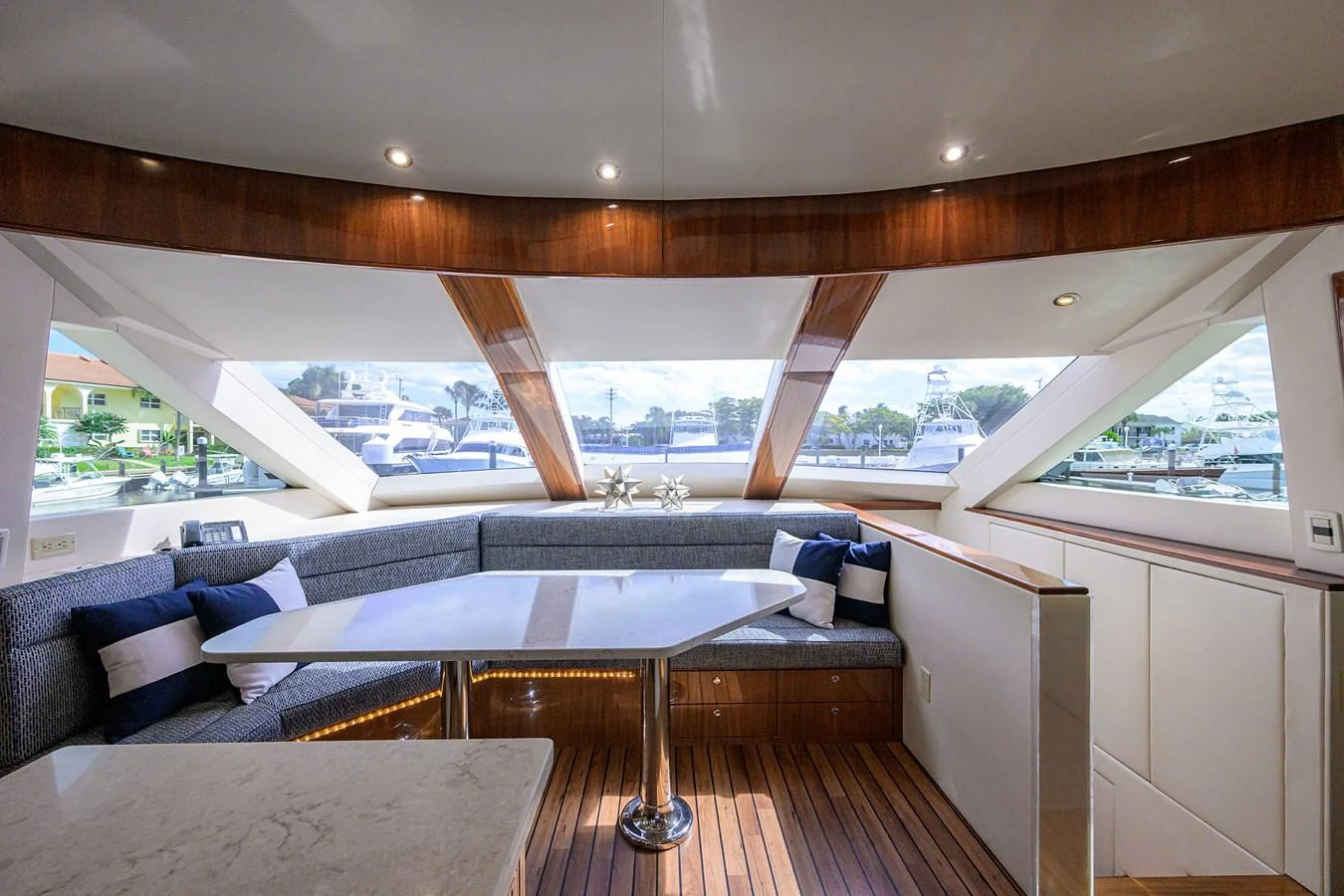 The salon features a spacious seating area with large windows offering panoramic views. aboard SAPPHIRE Yacht for Sale