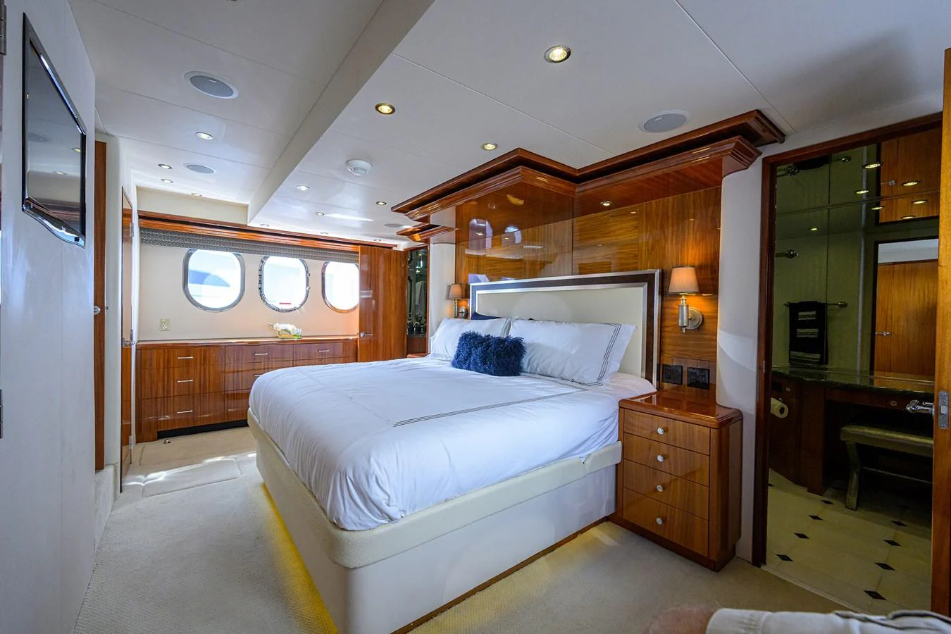 The master stateroom offers a spacious and luxurious retreat with elegant wood finishes and ample natural light. aboard SAPPHIRE Yacht for Sale