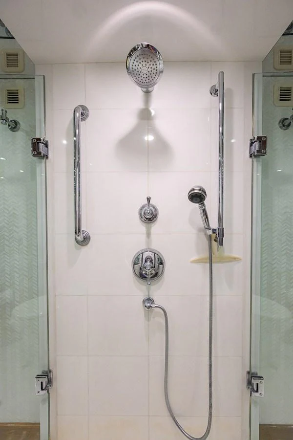 A pristine shower area with modern fixtures and glass doors. aboard SAPPHIRE Yacht for Sale