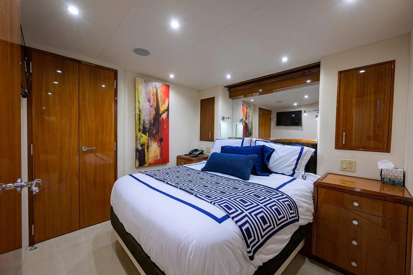 The stateroom features a luxurious bed with elegant bedding and modern decor. aboard SAPPHIRE Yacht for Sale