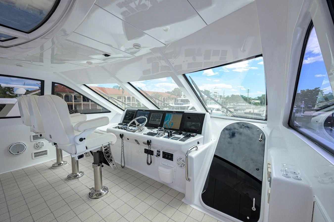 The helm station features modern navigation equipment and comfortable seating with panoramic views. aboard SAPPHIRE Yacht for Sale