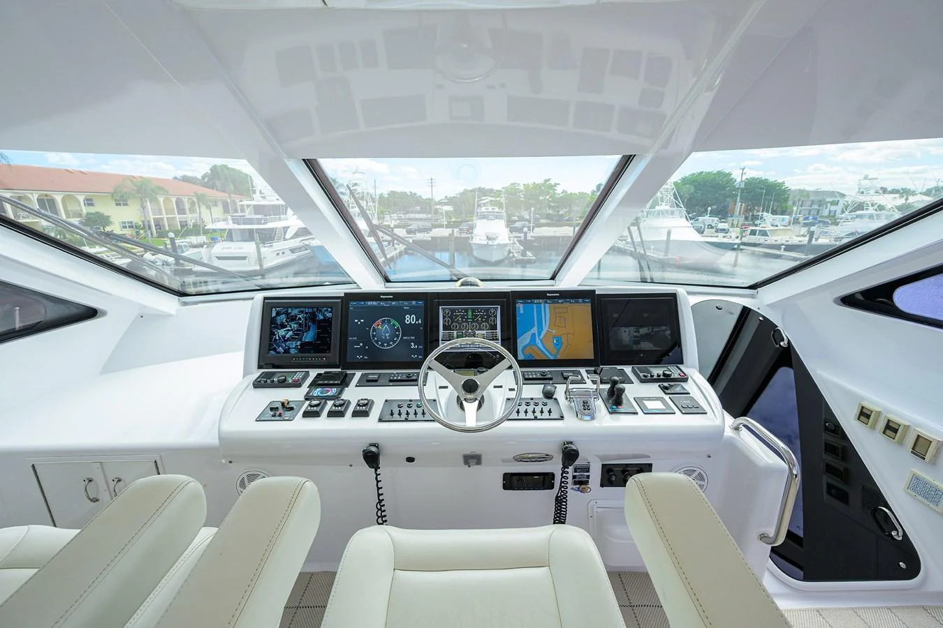 The helm station features advanced navigation equipment and a panoramic view of the marina. aboard SAPPHIRE Yacht for Sale