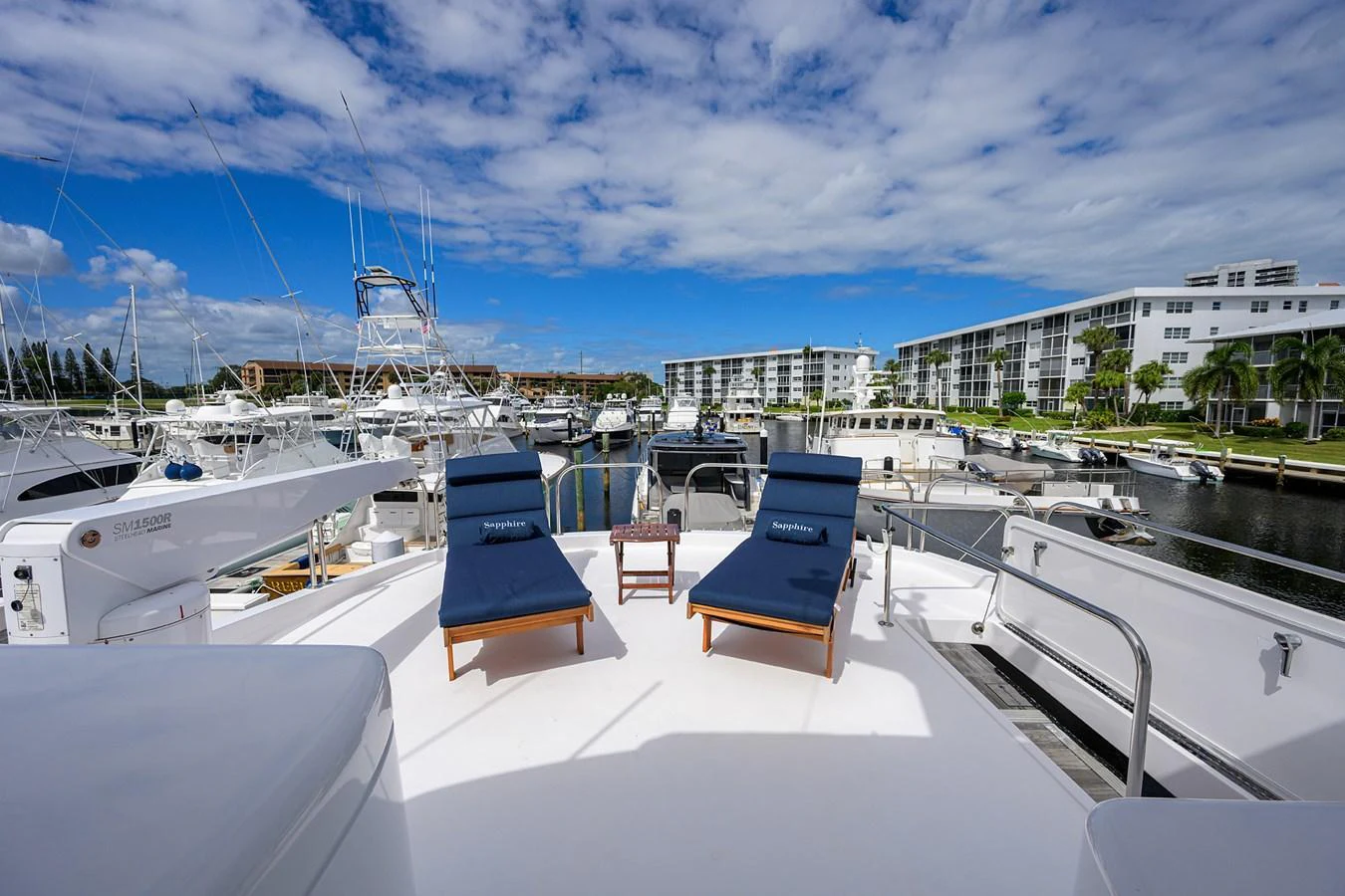 The sundeck features comfortable lounge chairs with a beautiful marina view. aboard SAPPHIRE Yacht for Sale