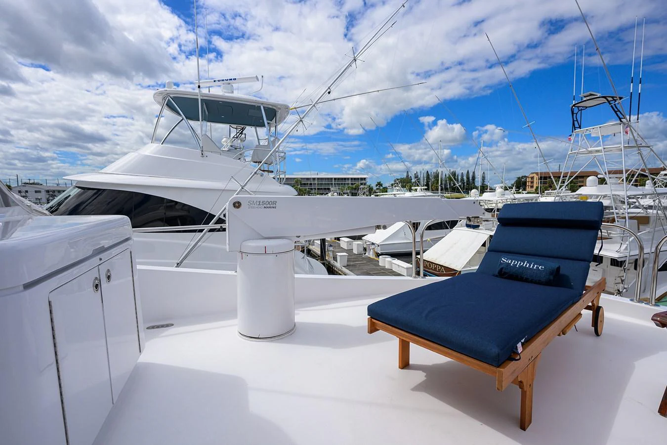 The sundeck features a comfortable lounge chair with a view of the marina. aboard SAPPHIRE Yacht for Sale