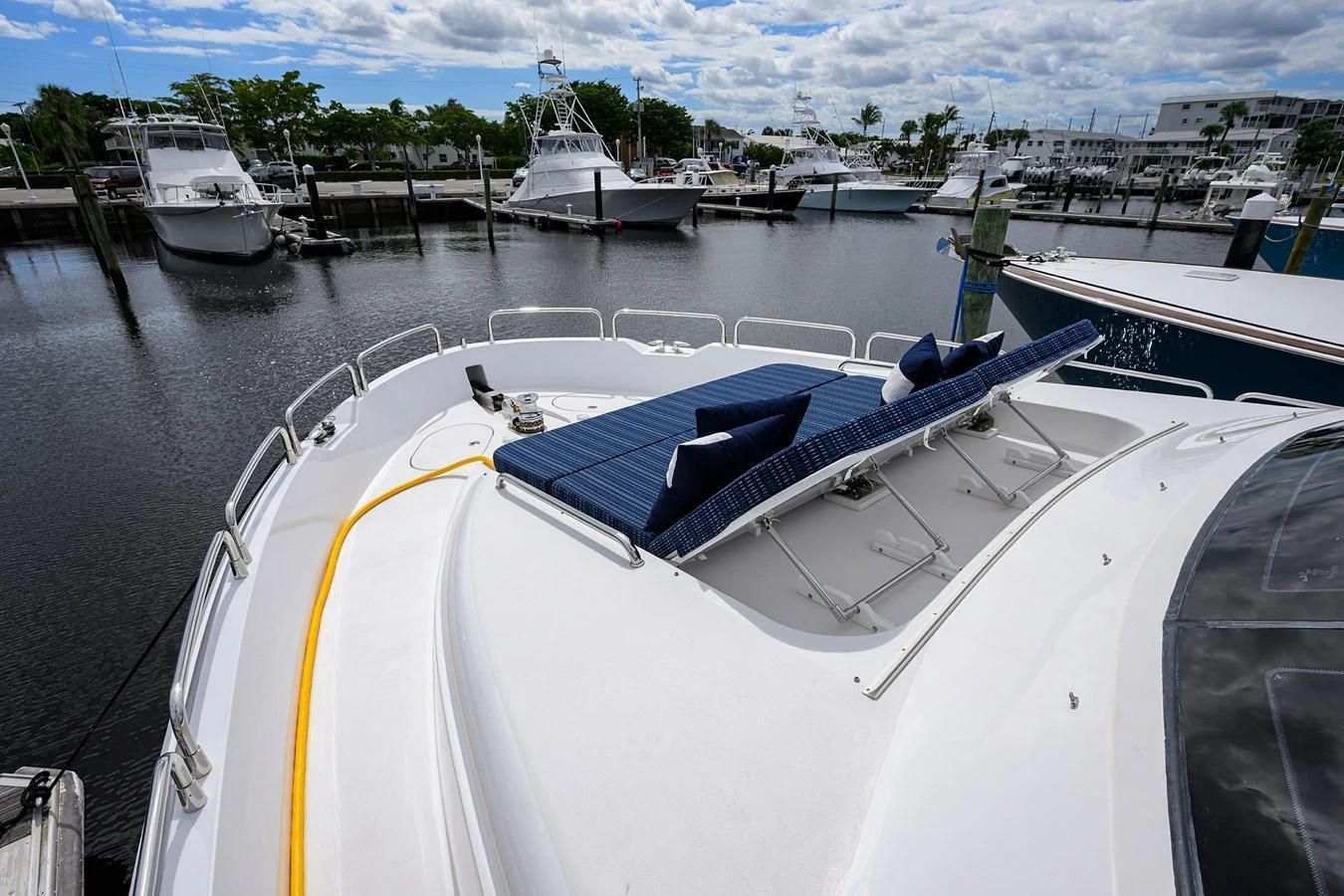 The foredeck features comfortable sun loungers, perfect for relaxation while docked at the marina. aboard SAPPHIRE Yacht for Sale
