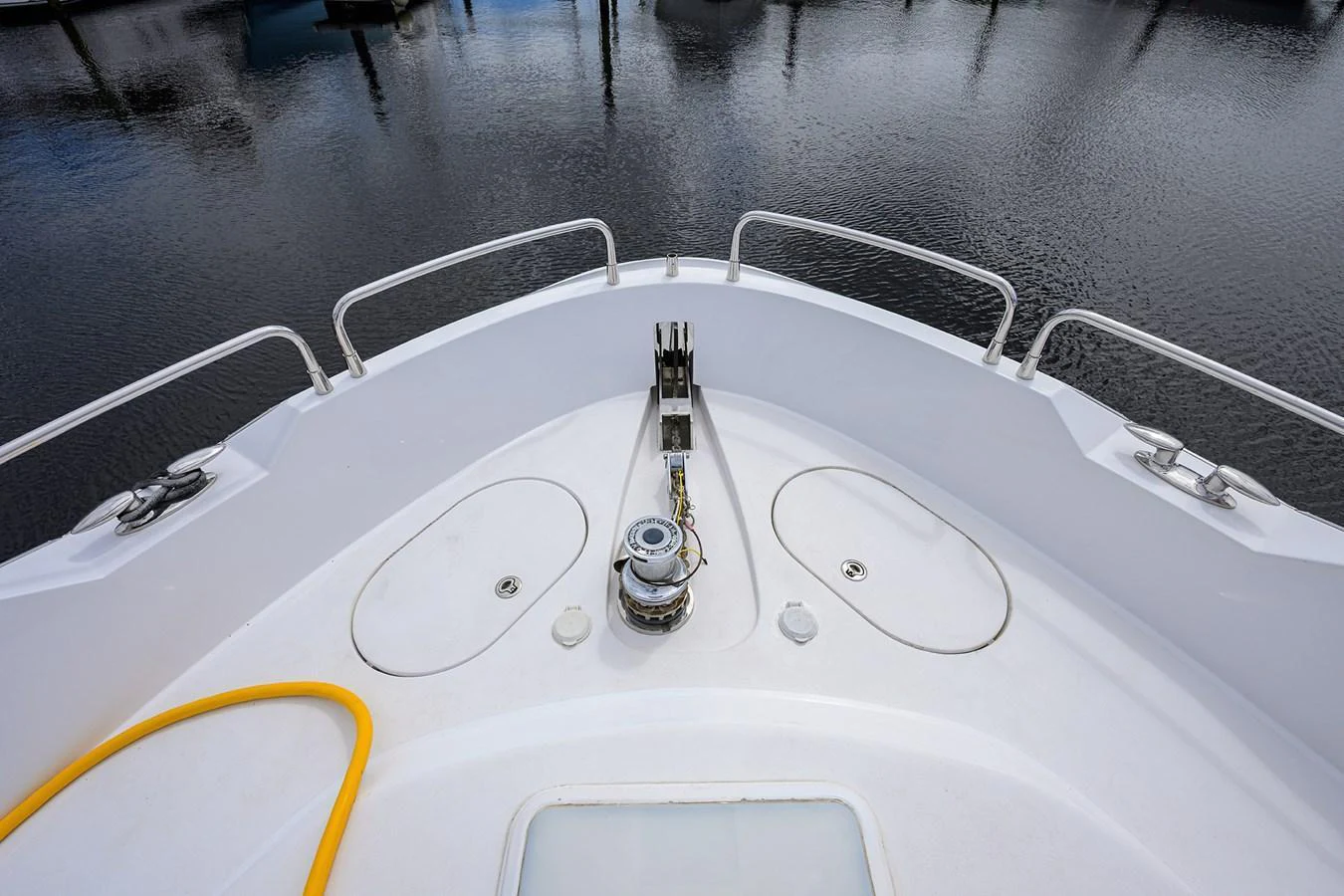 The image showcases the bow area of a yacht with a focus on the anchor winch and deck fittings. aboard SAPPHIRE Yacht for Sale