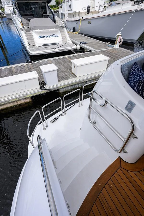 A detailed view of the yacht's stairway leading down to the swim platform, showcasing the sleek design and craftsmanship. aboard SAPPHIRE Yacht for Sale