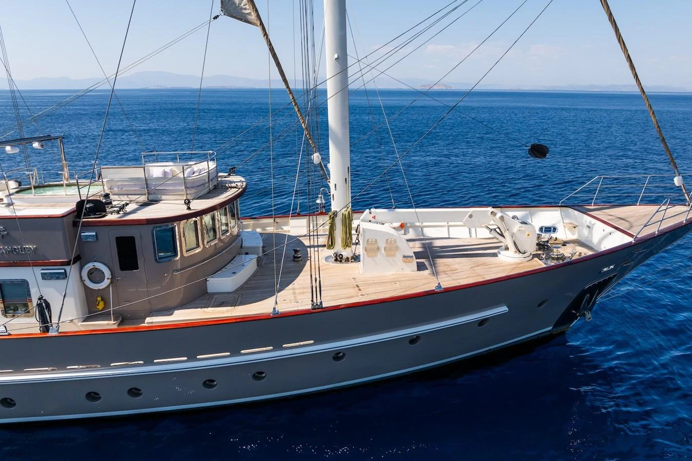 a couple of boats in the water aboard THE LANGLEY Yacht for Sale