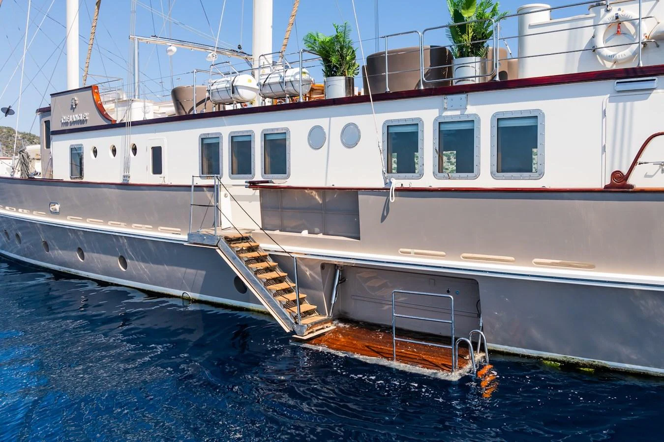 a boat docked at a pier aboard THE LANGLEY Yacht for Sale