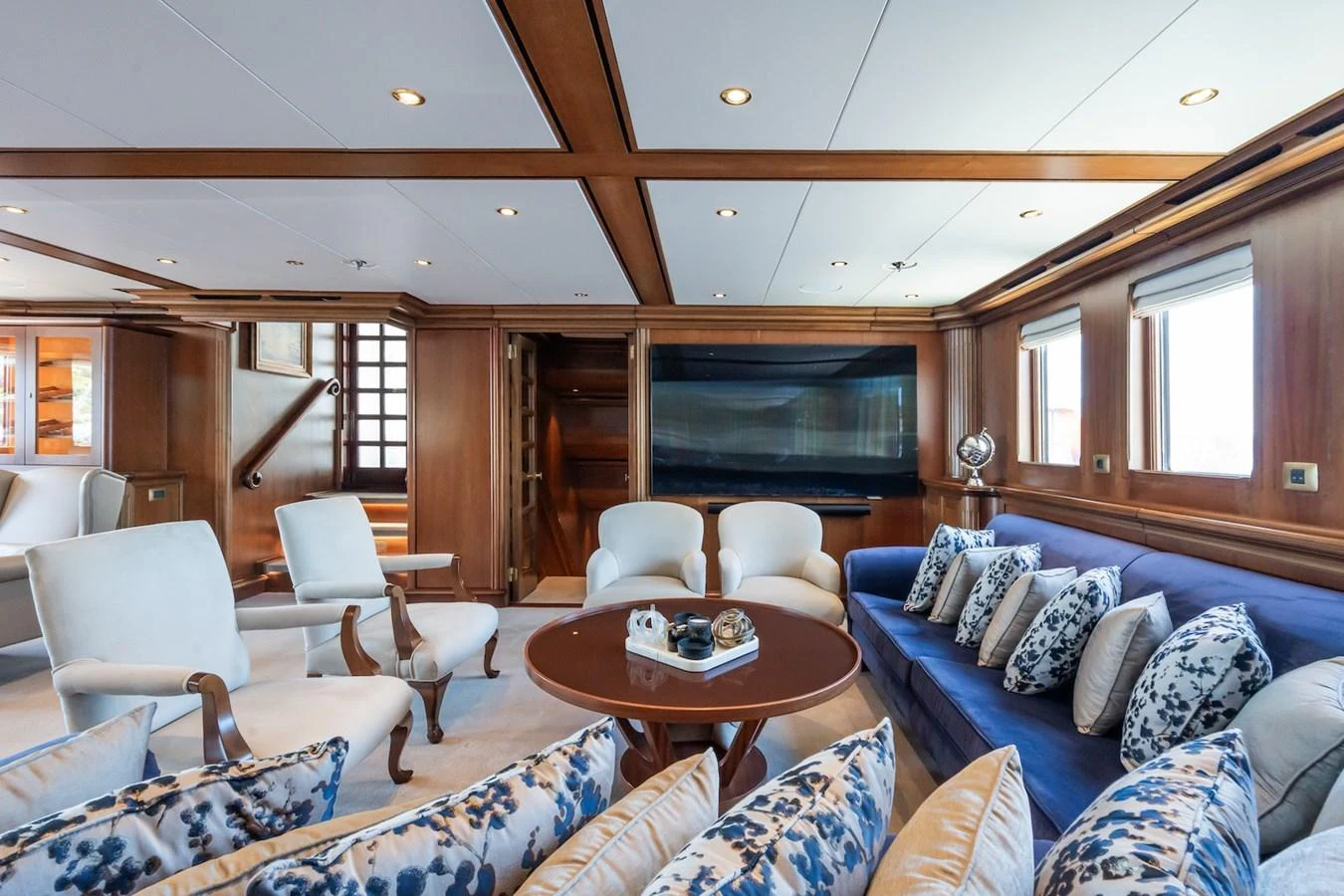 a living room with a table and chairs aboard THE LANGLEY Yacht for Sale