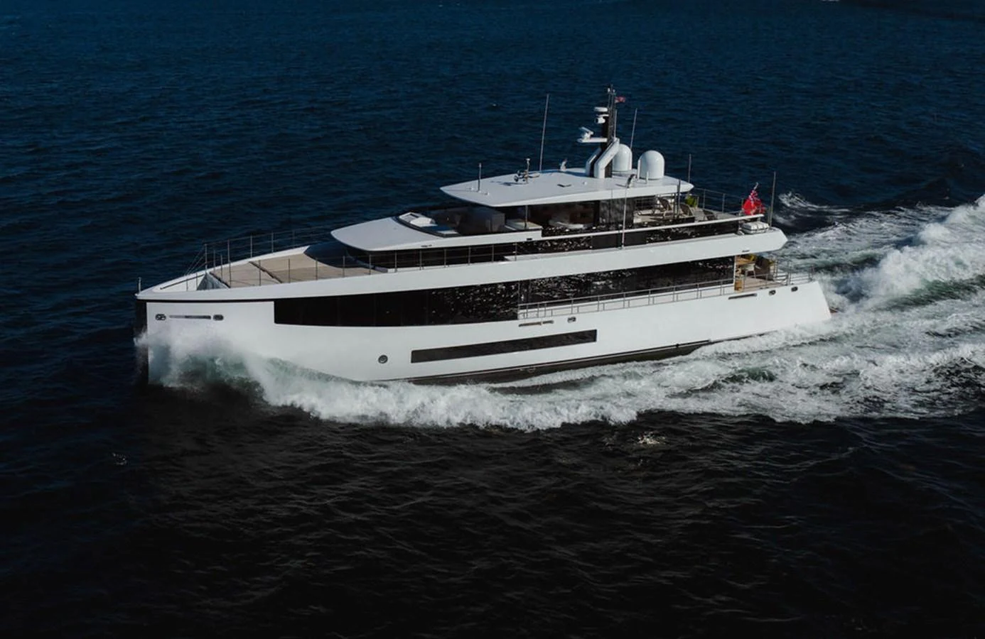 A sleek and modern yacht cruises through the water, showcasing its elegant design and spacious decks. aboard GRAYCLIFFS Yacht for Sale