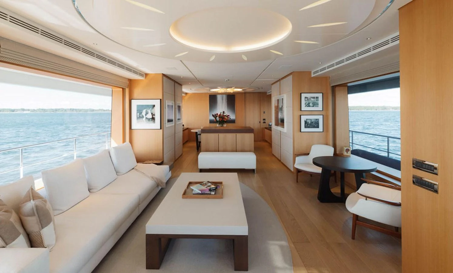 The salon features a spacious and elegantly designed seating area with panoramic views of the sea. aboard GRAYCLIFFS Yacht for Sale
