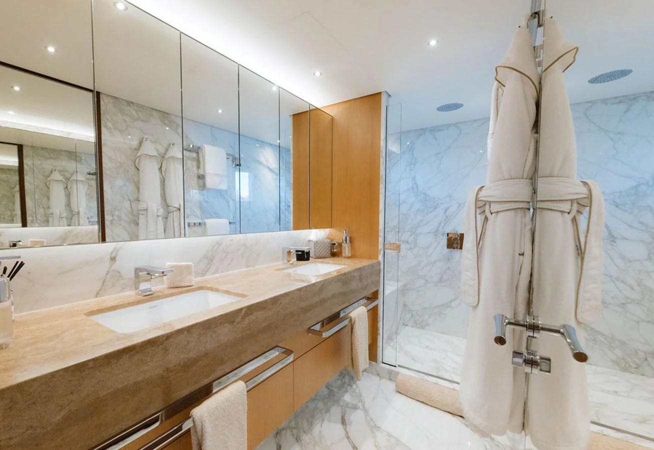 The yacht's bathroom features luxurious marble finishes and modern amenities. aboard GRAYCLIFFS Yacht for Sale