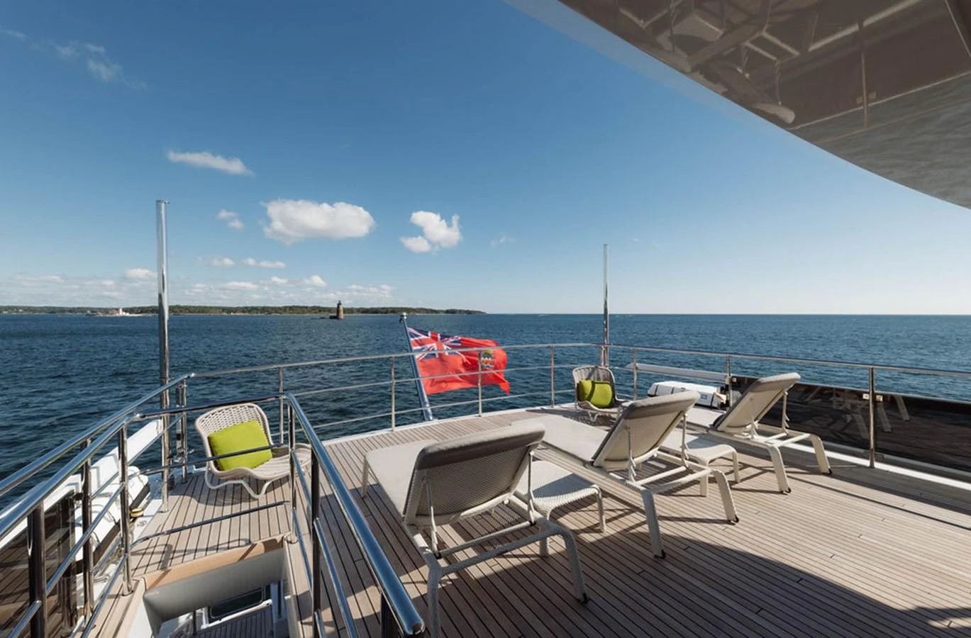 The aft deck offers a spacious lounging area with sunbeds and a stunning view of the open sea. aboard GRAYCLIFFS Yacht for Sale