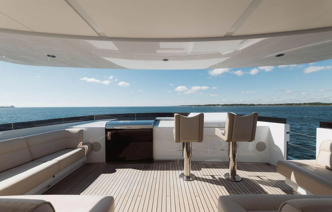 The aft deck offers a spacious and luxurious area for relaxation and socializing with stunning ocean views. aboard GRAYCLIFFS Yacht for Sale