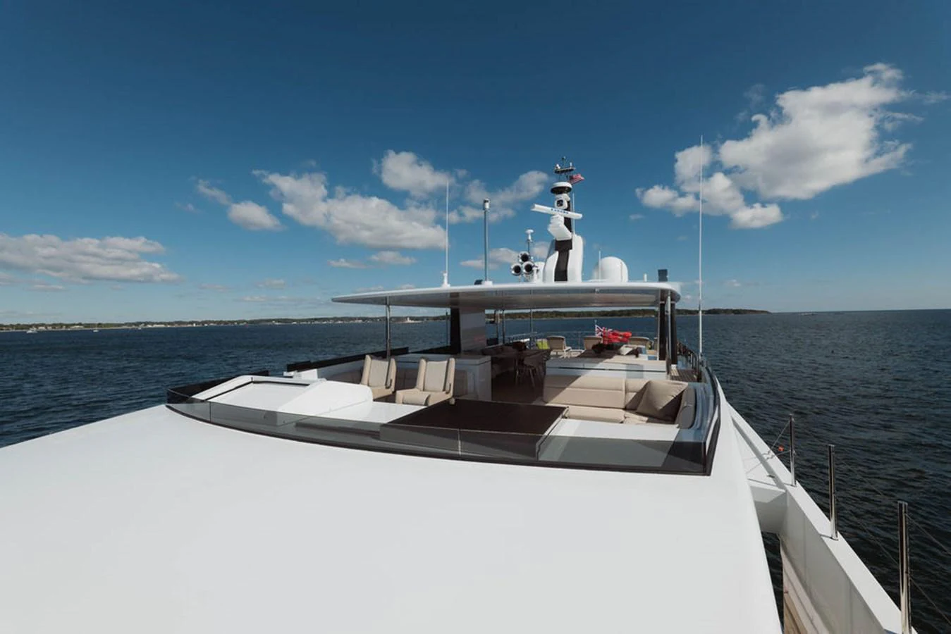 The yacht's flybridge offers a spacious and luxurious outdoor area with ample seating and stunning views of the open water. aboard GRAYCLIFFS Yacht for Sale