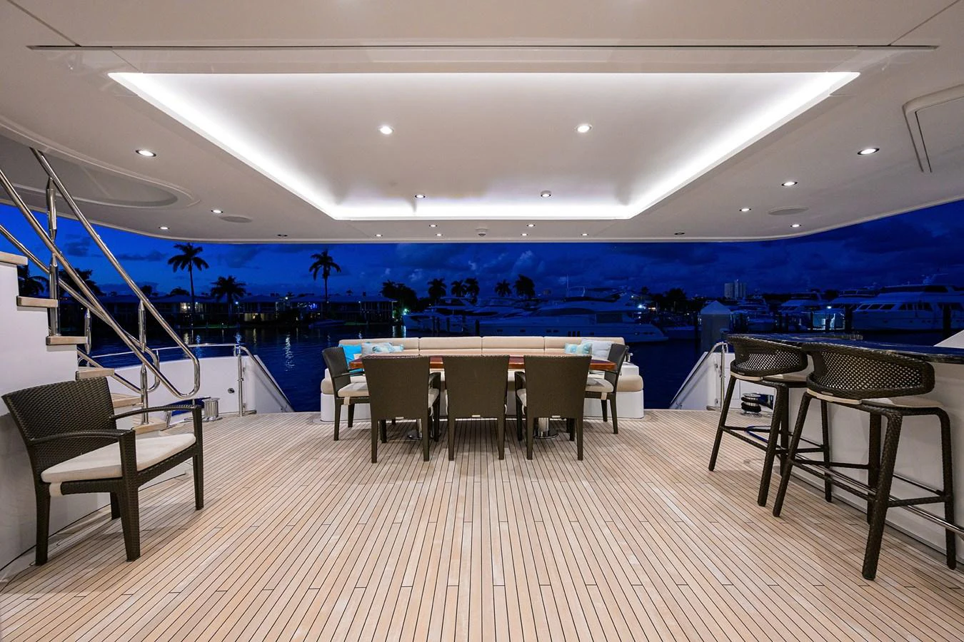 a room with a pool table and chairs aboard RENNEGADE Yacht for Sale