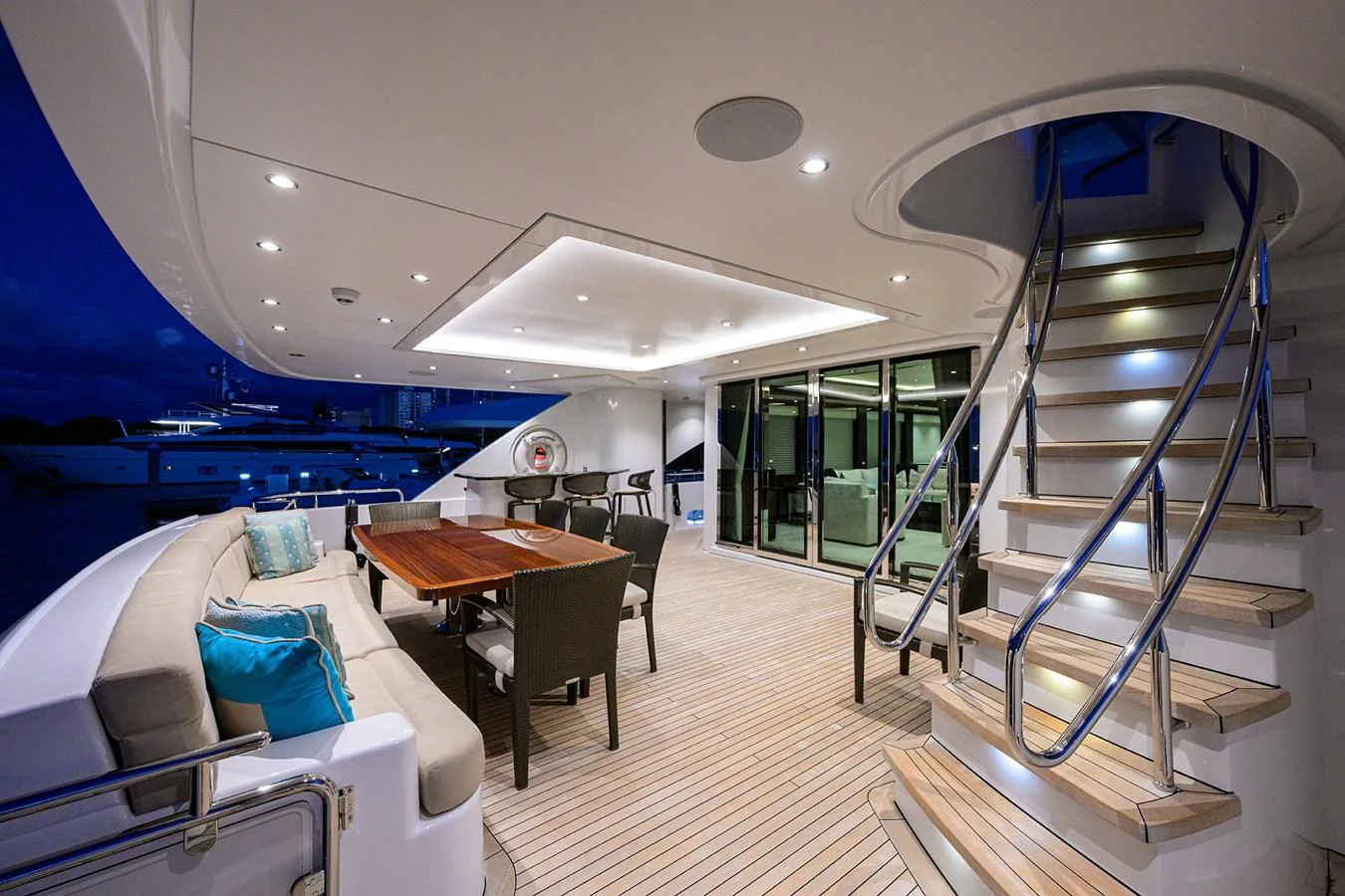 a room with a bed and a table and chairs aboard RENNEGADE Yacht for Sale