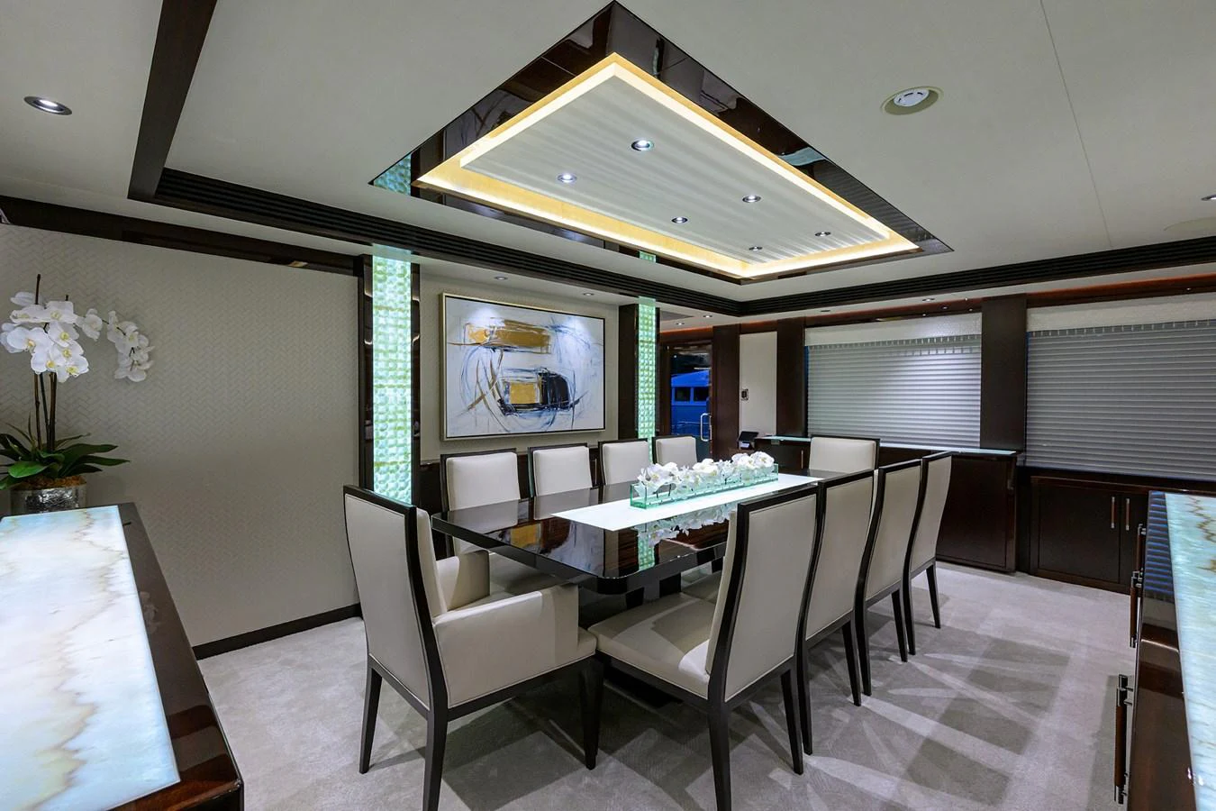 a room with a table and chairs aboard RENNEGADE Yacht for Sale