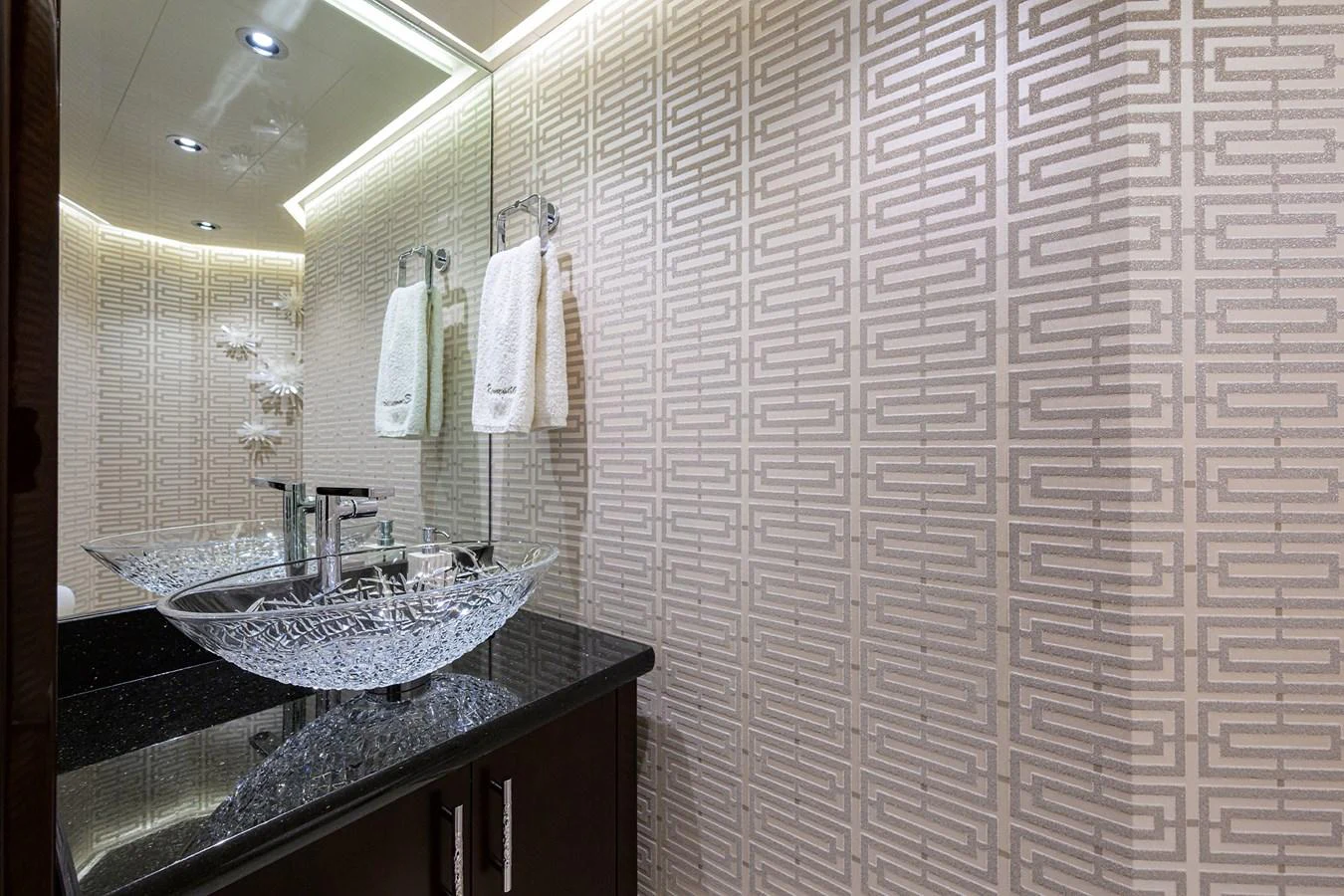 a bathroom with a sink and a mirror aboard RENNEGADE Yacht for Sale