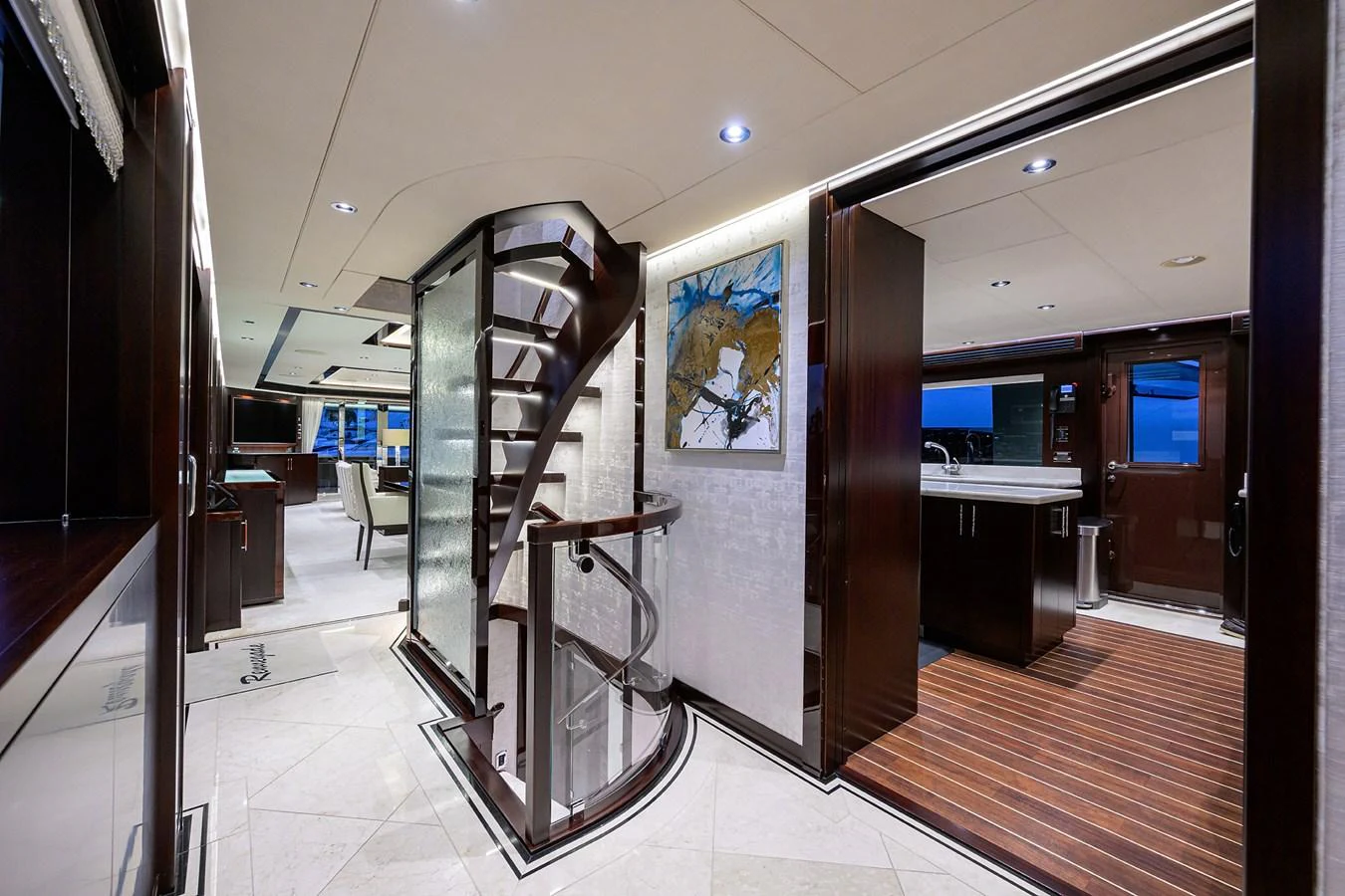 a hallway with a ladder and a glass door aboard RENNEGADE Yacht for Sale