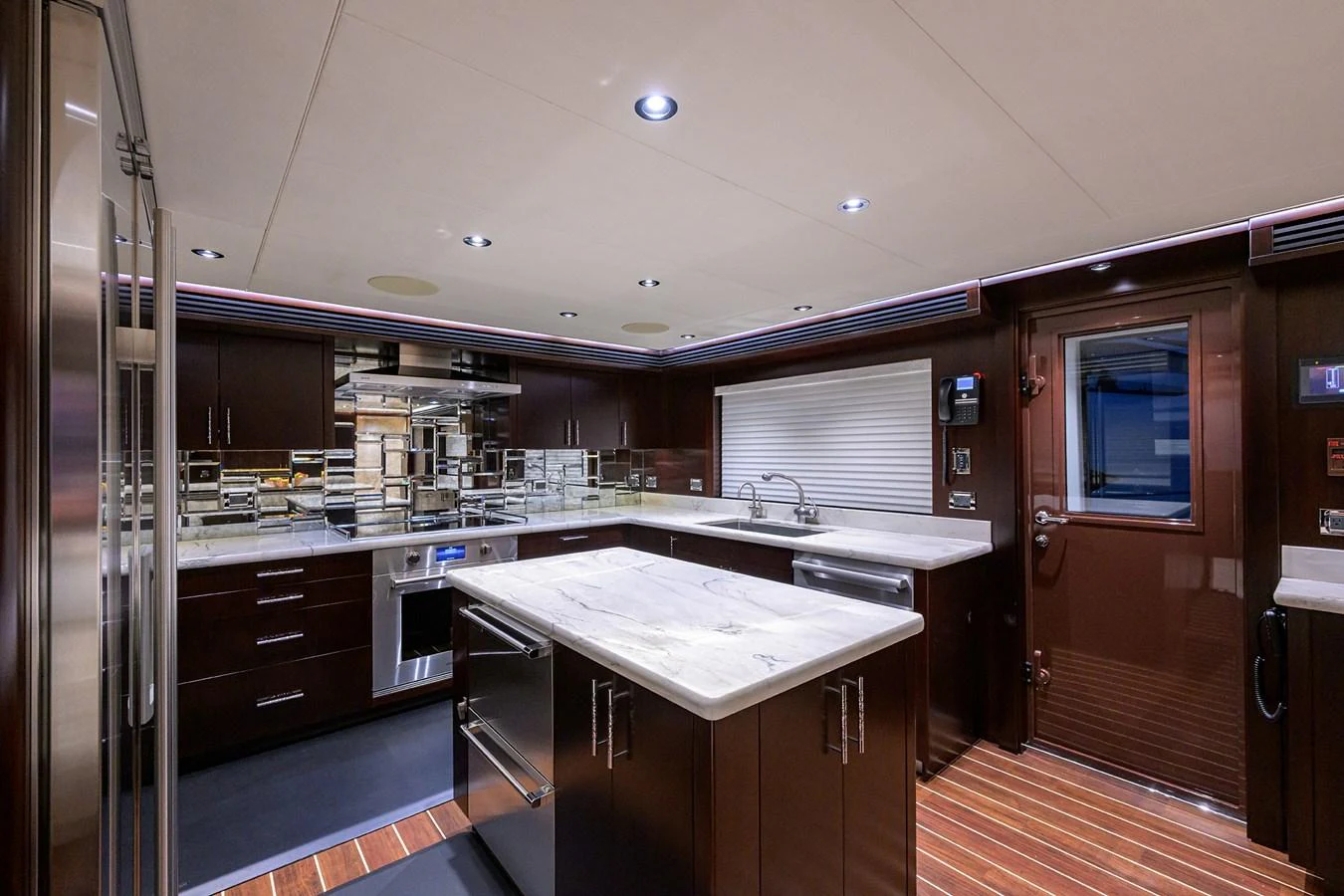 a kitchen with a large island aboard RENNEGADE Yacht for Sale