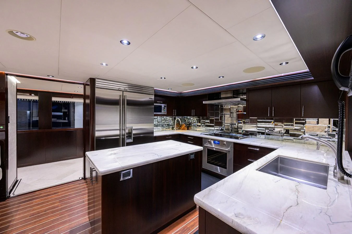 a kitchen with a large island aboard RENNEGADE Yacht for Sale