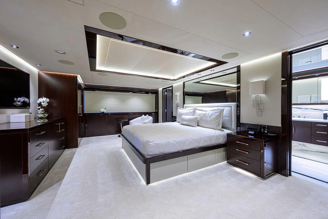 a bedroom with a bed and a desk aboard RENNEGADE Yacht for Sale
