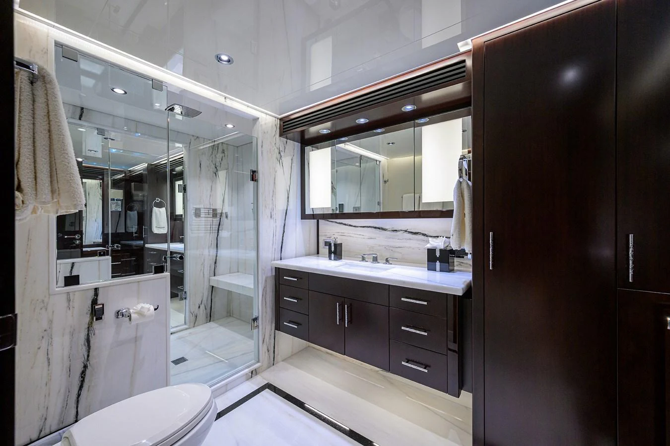 a bathroom with a large mirror aboard RENNEGADE Yacht for Sale