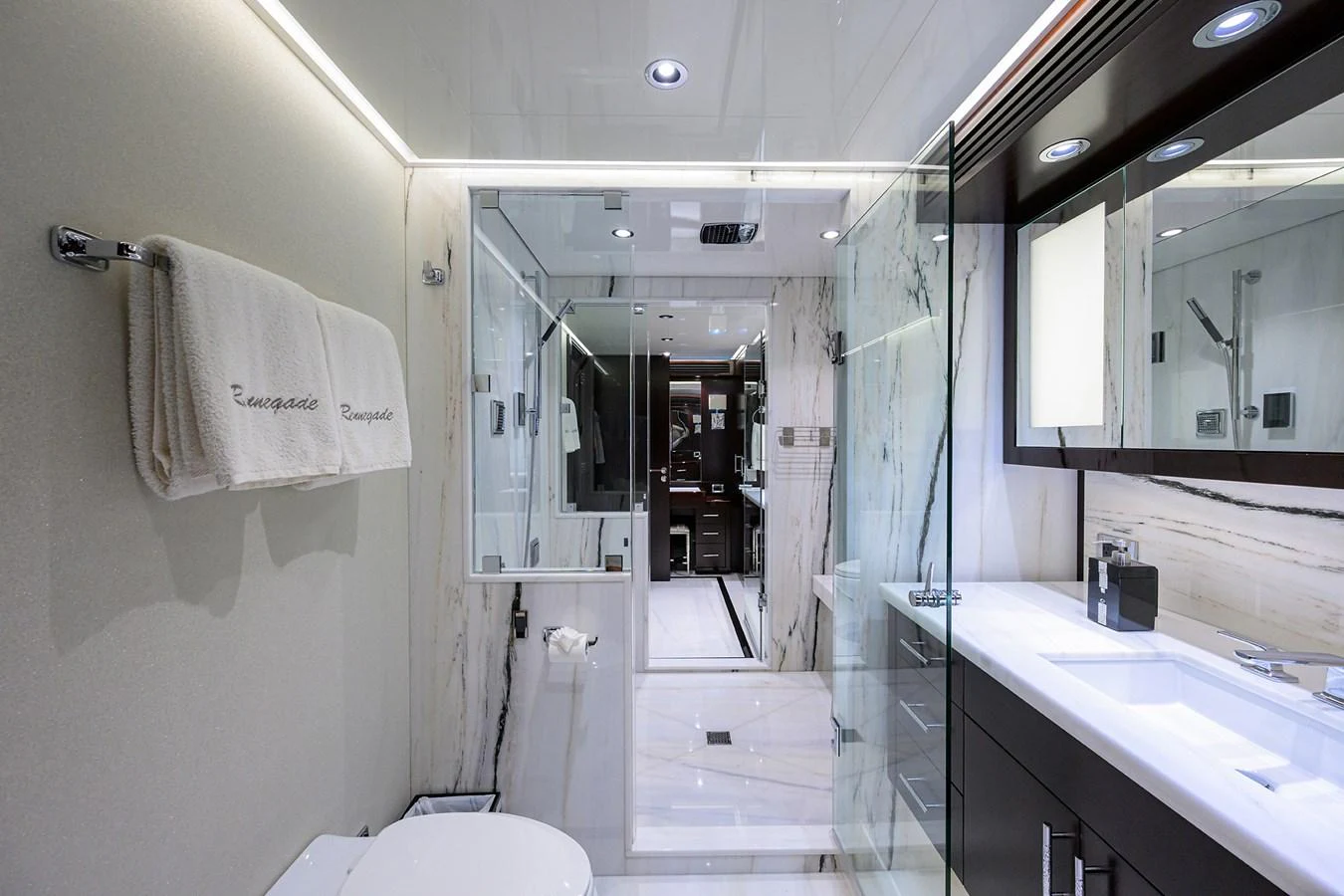 a bathroom with a sink and a mirror aboard RENNEGADE Yacht for Sale