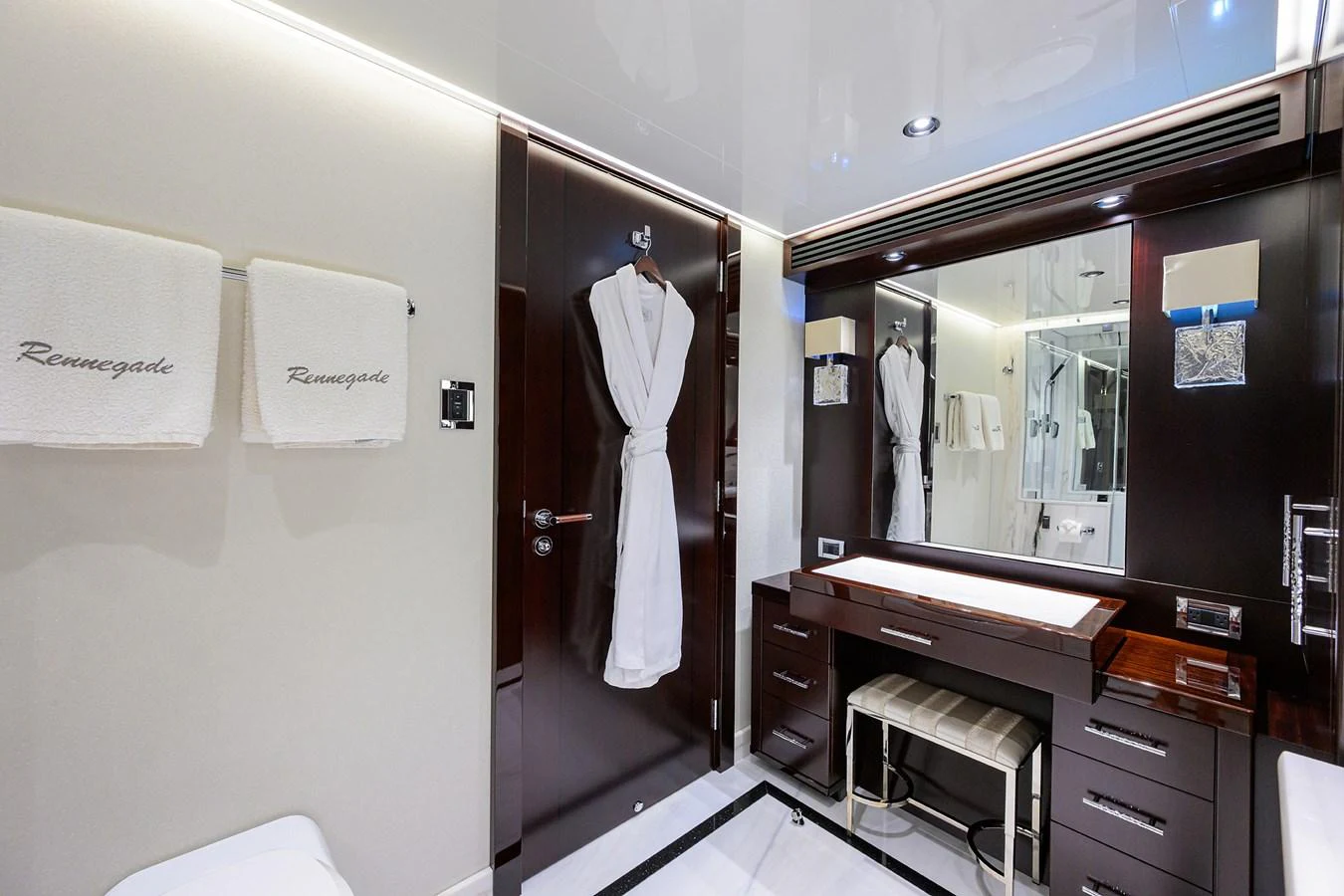 a bathroom with a mirror and a sink aboard RENNEGADE Yacht for Sale