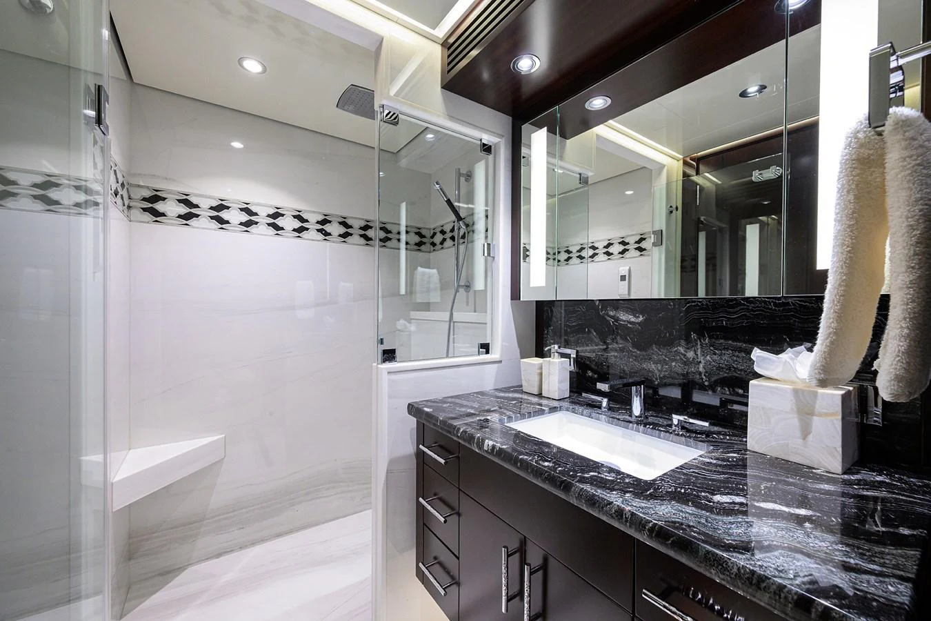 a bathroom with a countertop sink and mirror aboard RENNEGADE Yacht for Sale